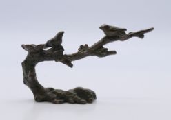 A bronze model of birds in a tree. 5 cm high.