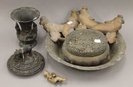 A quantity of metalware, including a bronze bowl, two brass dolphins, etc. The bowl 35 cm diameter.