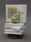 A ceramic Peter Rabbit music box. 16 cm high.