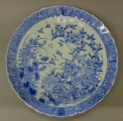 A 19th century Oriental blue and white porcelain charger. 47 cm diameter.