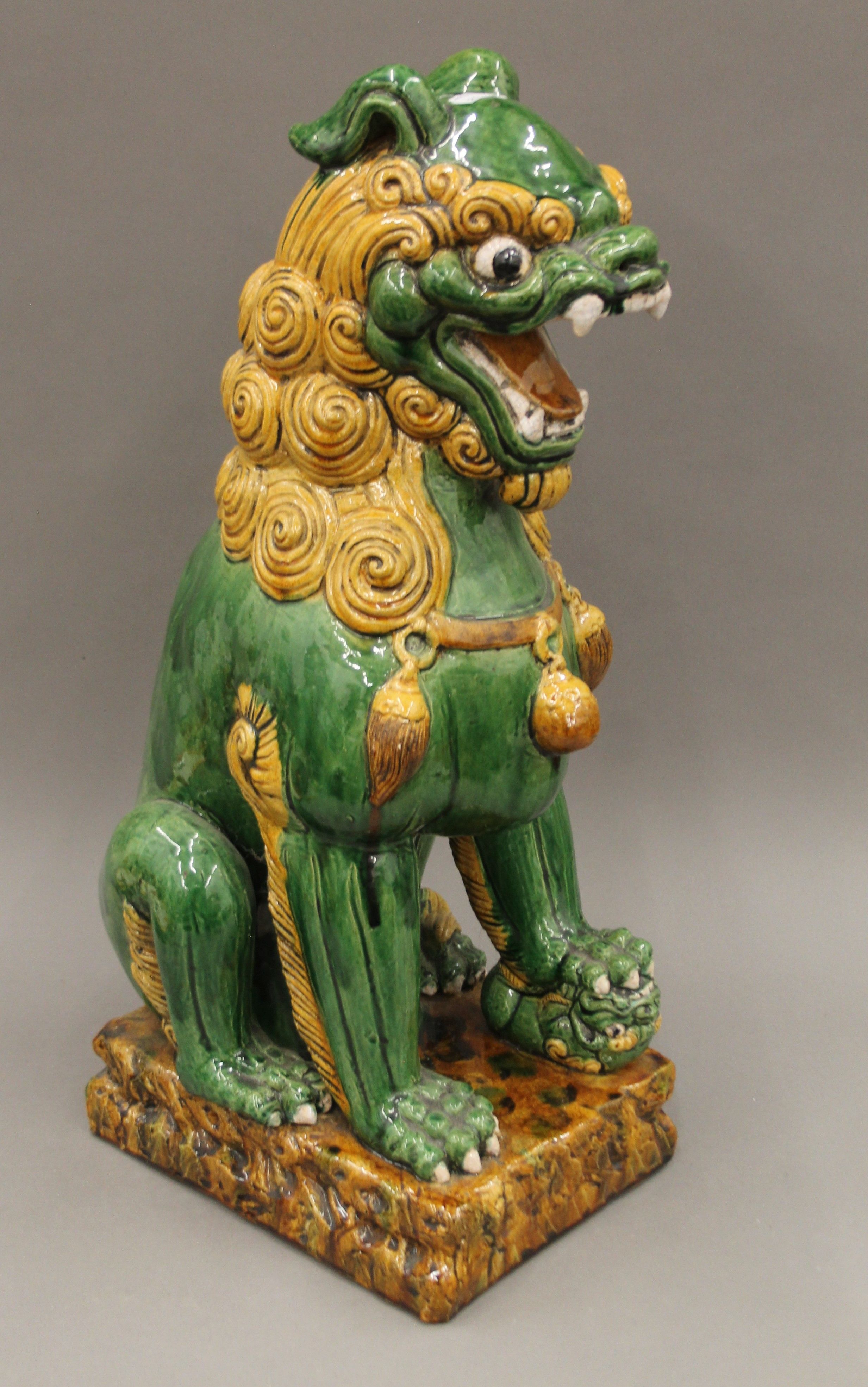 A large Chinese pottery dog-of-fo. 60 cm high.