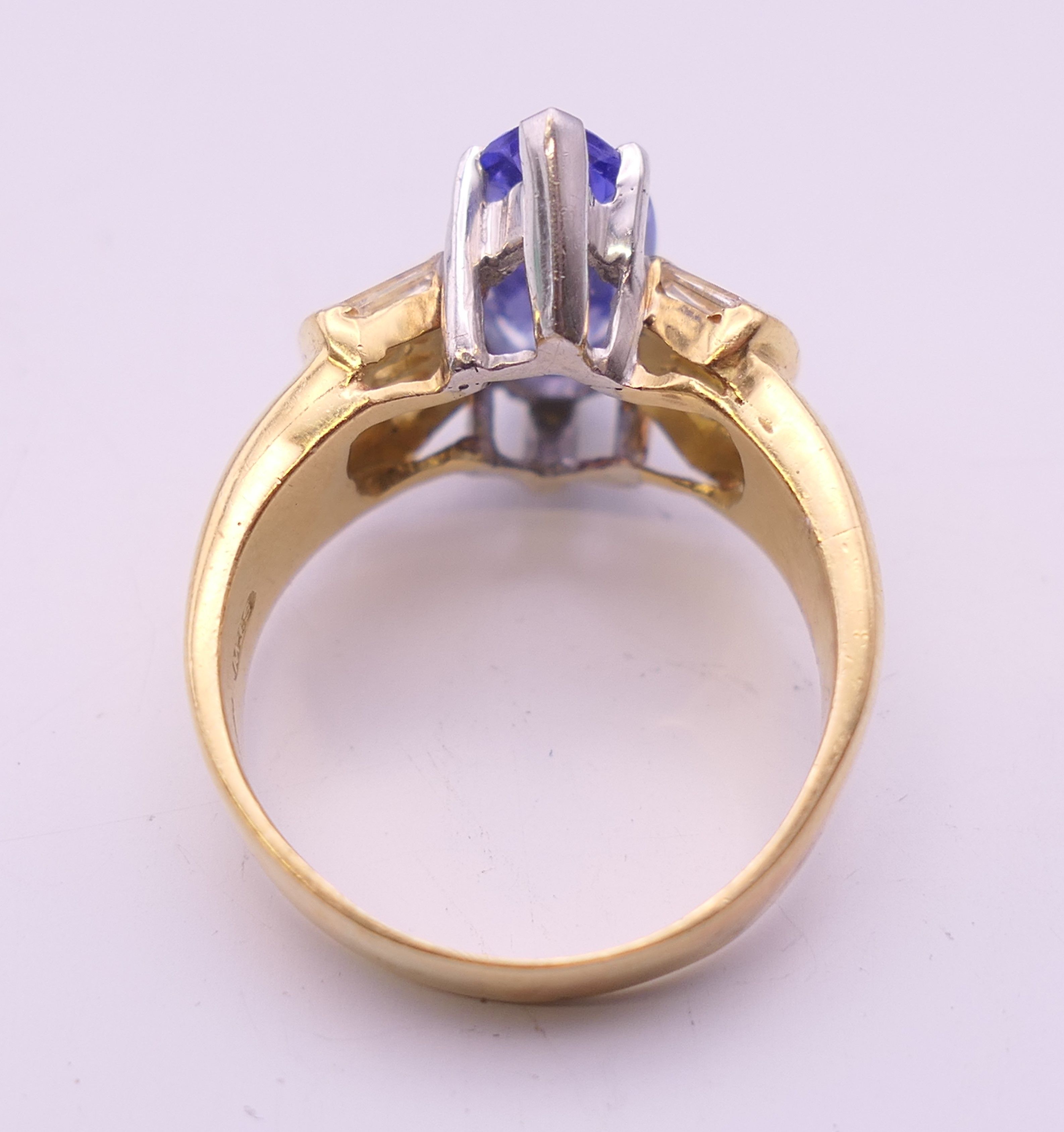 An 18 ct gold tanzanite and baguette diamond ring. Ring size O/P. - Image 7 of 8