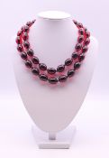 A bead necklace. 84 cm long.