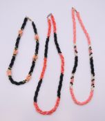 Three coral set necklaces. The smallest 42 cm long.