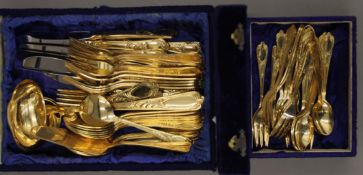Two boxes of gold plated cutlery (12 place sets).