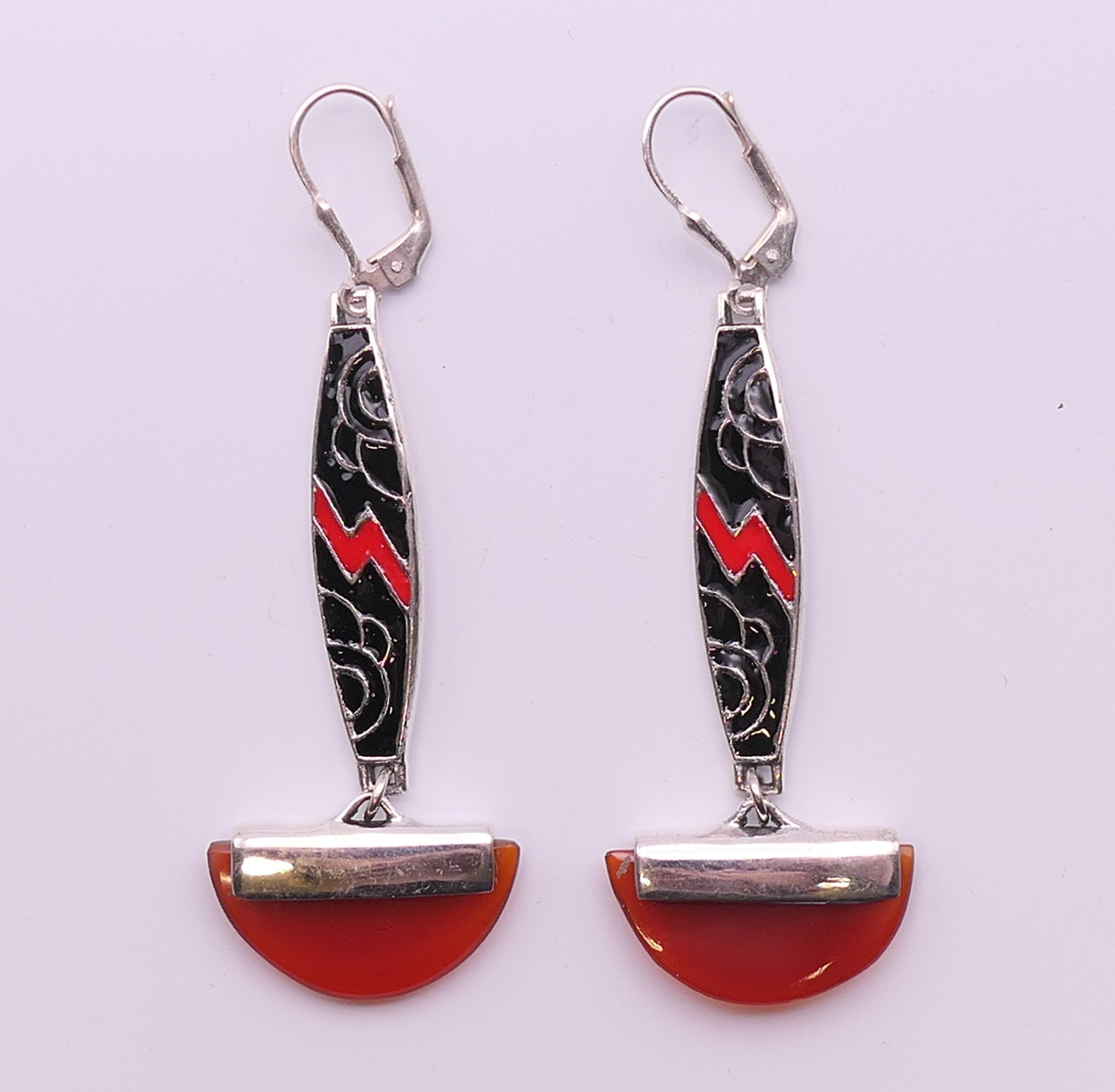 A pair of Art Deco style silver enamel and cornelian earrings. 5 cm high.