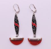 A pair of Art Deco style silver enamel and cornelian earrings. 5 cm high.