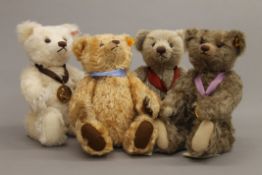 Four Steiff teddy bears, each housed in a Steiff display case - 2002 Bear of the Year,