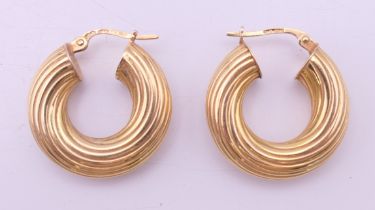 A pair of 9 ct gold earrings. 2 cm high. 3.3 grammes.