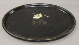 A florally decorated Victorian papier mache tray. 60 cm long.