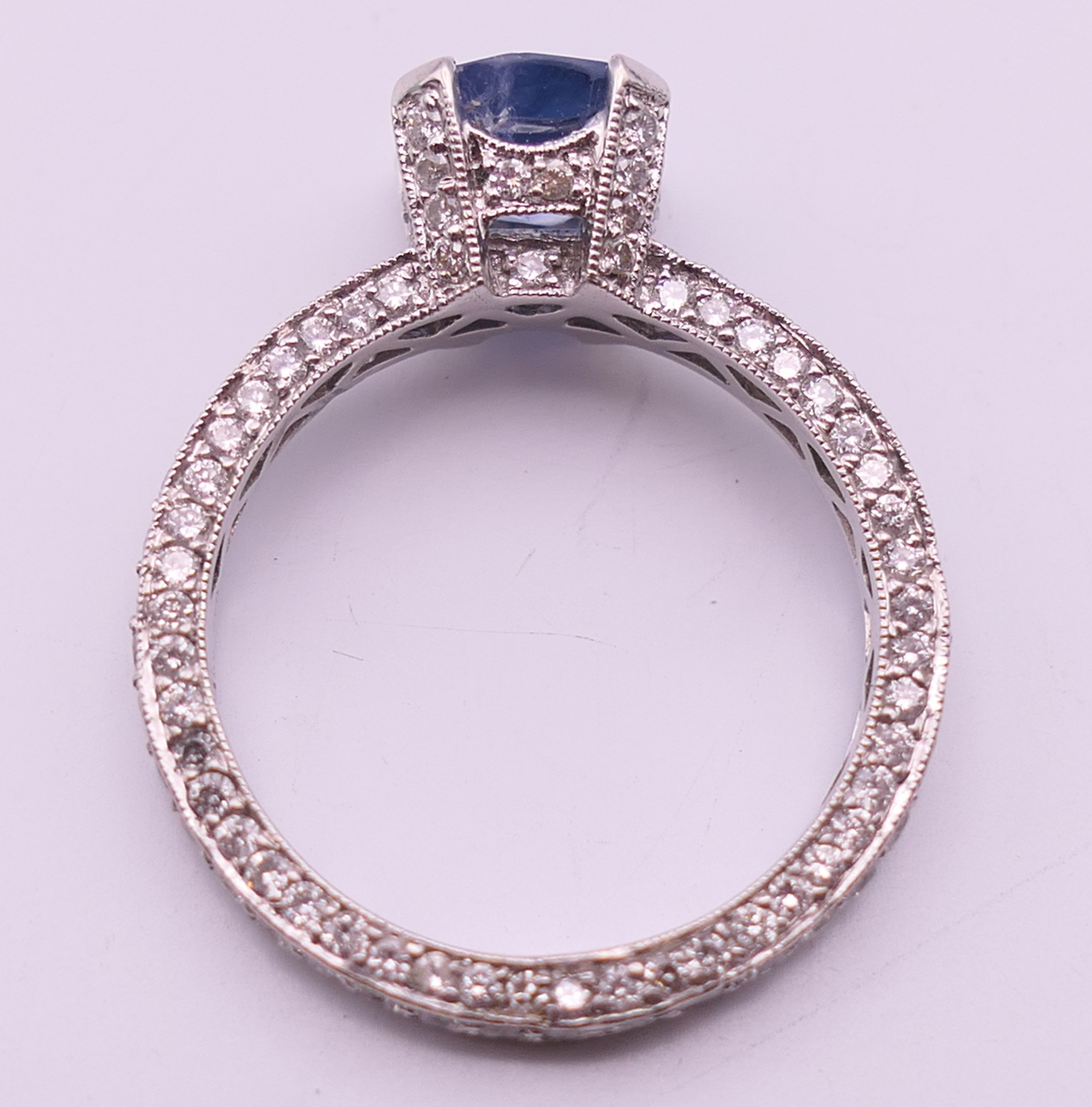 An 18 ct gold sapphire and diamond ring. Total diamond weight approximately 2.5 carats. - Image 8 of 11