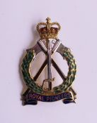 A gold and enamel Royal Pioneers brooch. 3.25 cm high. 6.2 grammes total weight.