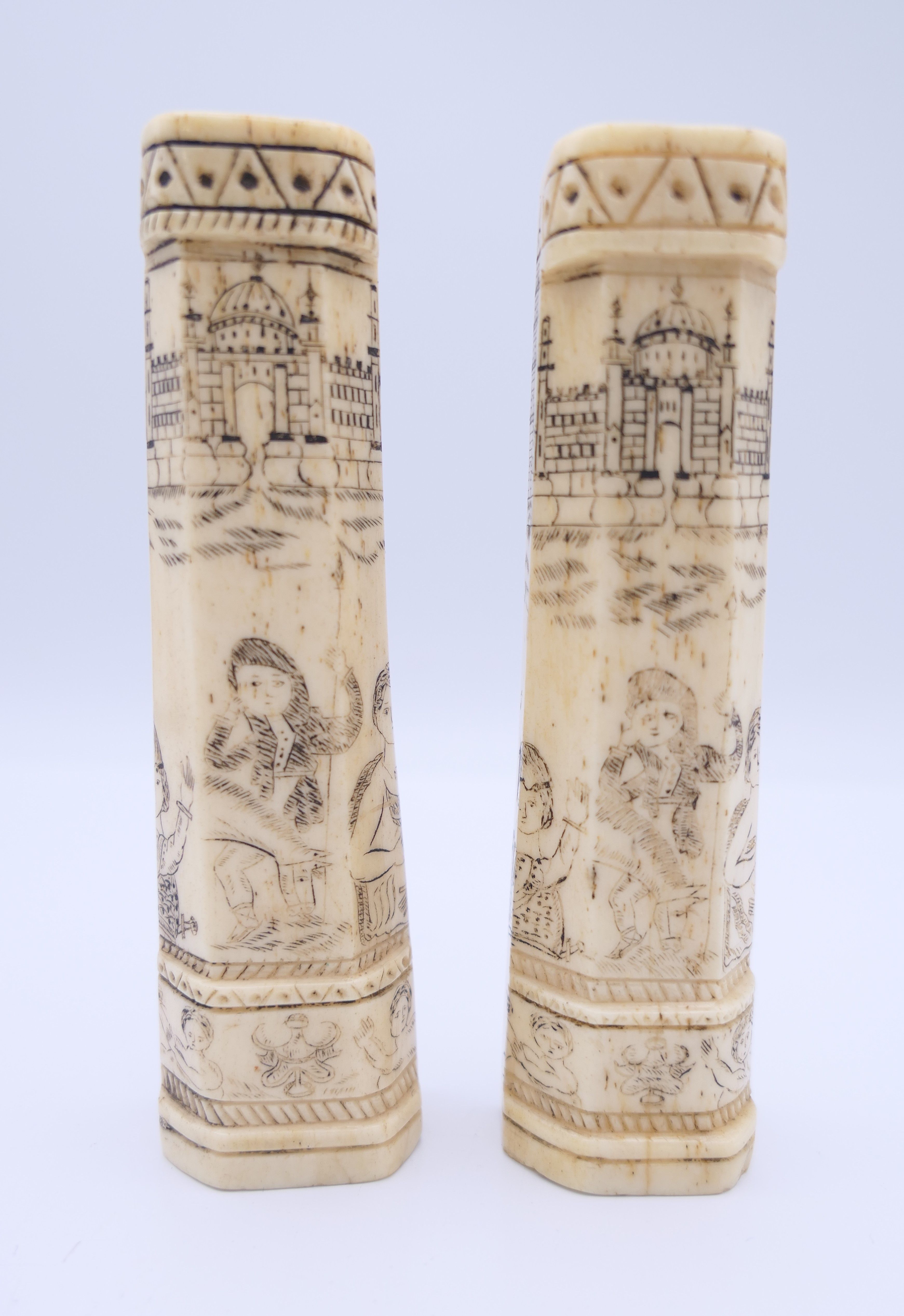 A pair of antique bone carvings, possibly Napoleonic Prisoner of War work. The largest 10 cm high.