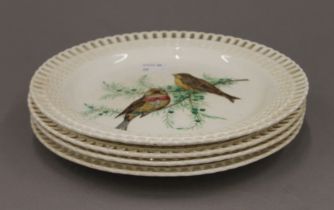 Four 19th century Mintons plates decorated with birds. 22.5 cm diameter.