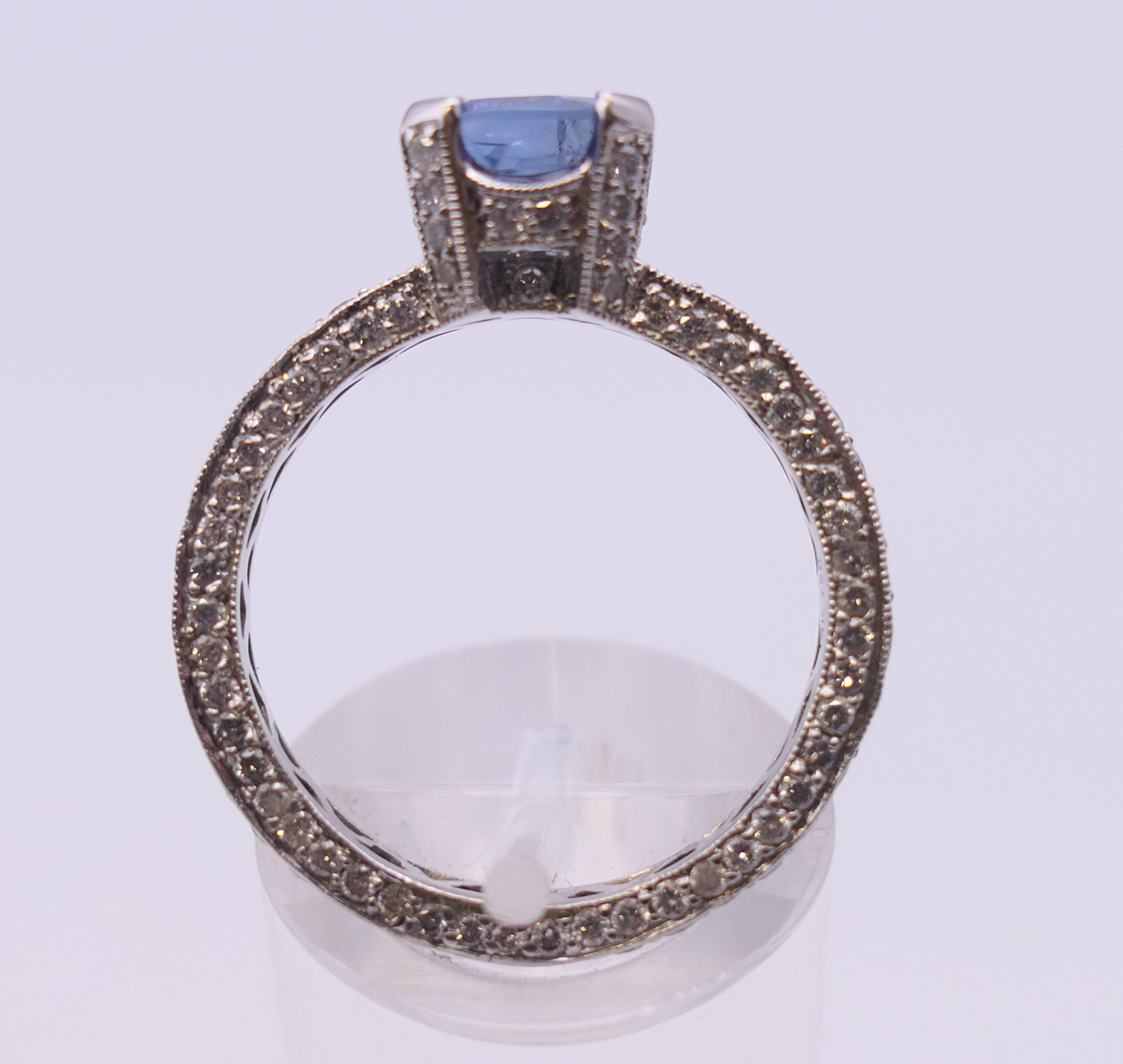 An 18 ct gold sapphire and diamond ring. Total diamond weight approximately 2.5 carats. - Image 6 of 11