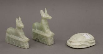 A carved alabaster scarab beetle and two alabaster cats. The former 8.5 cm long.