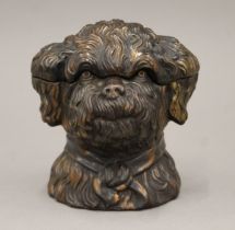 A 1920's brown glazed tobacco jar in the form of a dog's head. 11.5 cm high.