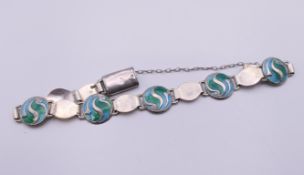 An Arts & Crafts Stainton Brothers silver enamel bracelet, hallmarked for Birmingham 1911.