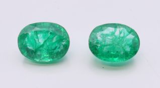 Two natural emeralds with laboratory certificates. The largest 8.87 ct.