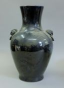 A Chinese black porcelain vase. 36 cm high.
