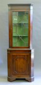 A modern mahogany corner cabinet. 186.5 cm high.
