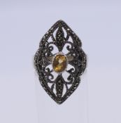 A silver marcasite and citrine ring. Ring size Q.