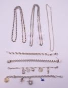 A quantity of silver necklaces and bracelets. 177.5 grammes.
