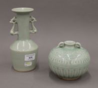 A celadon ground twin handled porcelain vase and a celadon ground twin handled porcelain vase.