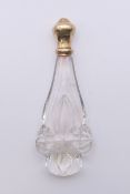 A French 18 ct gold topped scent bottle. 12 cm high.