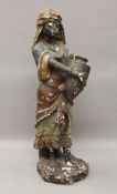 A painted statue of an African Lady Carrying an Amphora. 70 cm high.