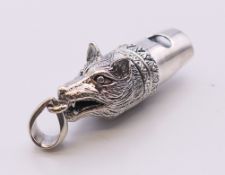 A fox mask whistle. 3.5 cm long.