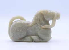 A jade dog-of-fo. 9 cm long.