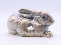 A silver model of a rabbit bearing Russian marks. 6.5 cm long. 62.2 grammes total weight.