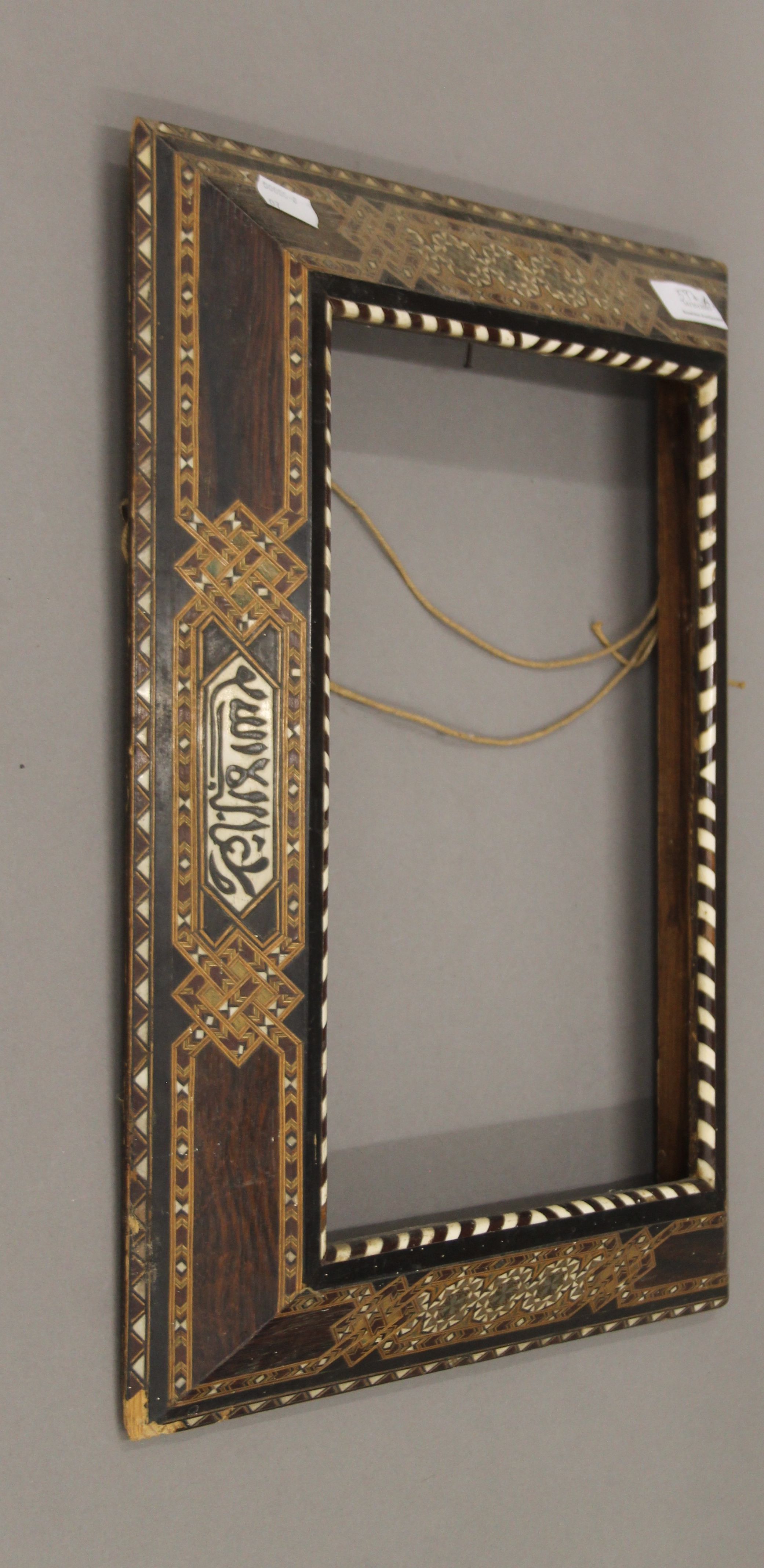 An Eastern bone inlaid frame. 34 x 44.5 cm.