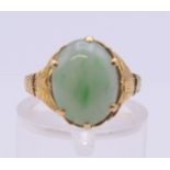 A Chinese jade set gold ring. Ring size I/J. 3.1 grammes total weight.