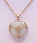 A Chinese jade and unmarked gold pendant on chain. The pendant 2.5 cm high. 10.