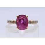 An 18 ct gold ruby and diamond ring. Ring size I.