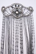 An Art Deco headdress. Approximately 83 cm long.