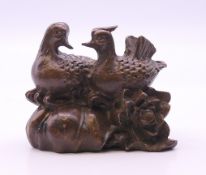 A bronze model of two ducks. 4.5 cm high.