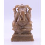 A carved stone model of a Ganesh. 7 cm high.