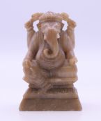 A carved stone model of a Ganesh. 7 cm high.