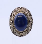 A silver filigree and lapis ring. Ring size K/L.