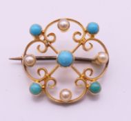 A 19th century 15 ct gold turquoise and pearl brooch. 2 cm diameter.