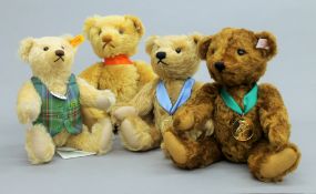 Four Steiff teddy bears, each housed in a Steiff display case - 2017 Bear of the Year,