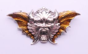 A silver Devil brooch. 5.5 cm wide.