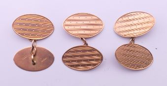 A pair of 9 ct gold cufflinks, together with a single 9 ct gold cufflink. Each 2 cm wide. 6.