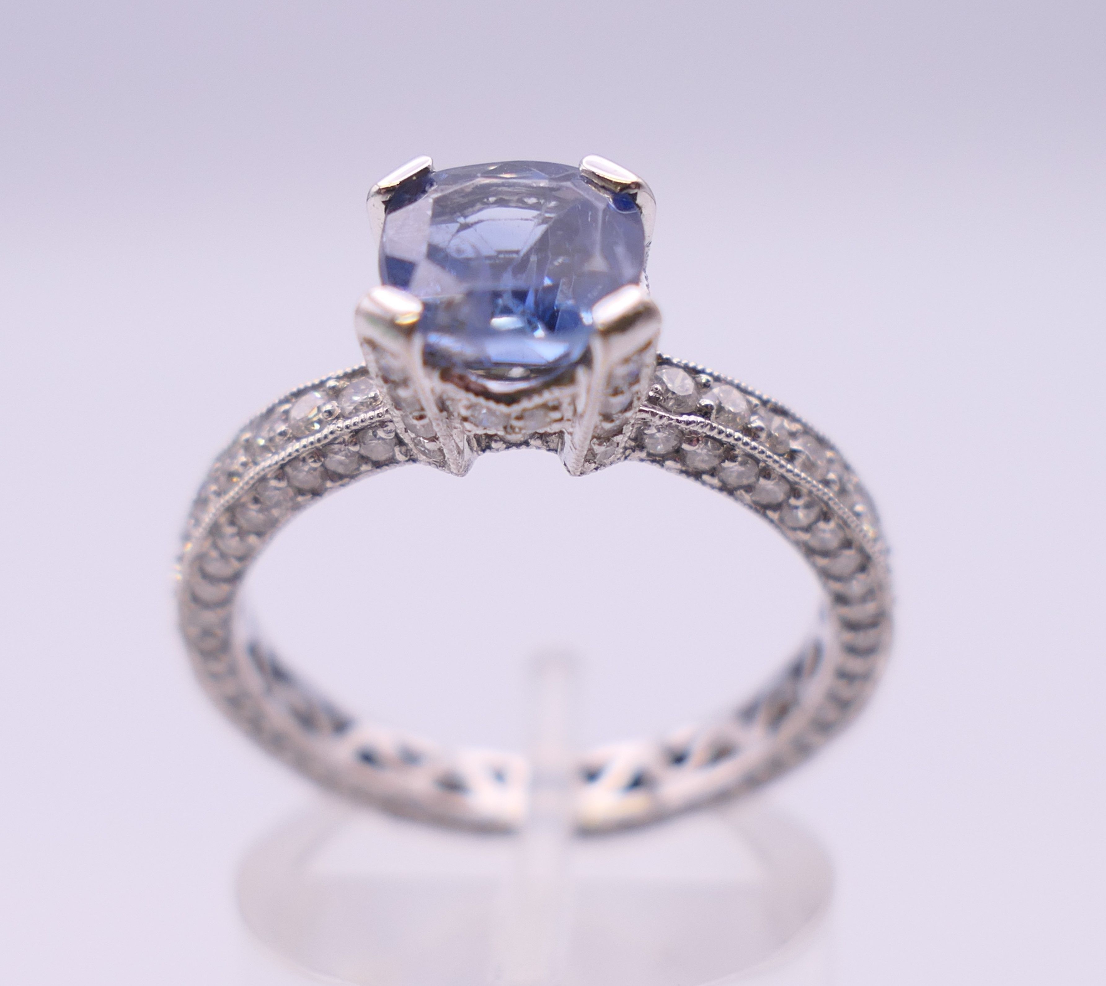 An 18 ct gold sapphire and diamond ring. Total diamond weight approximately 2.5 carats.
