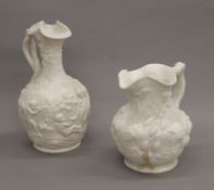 Two Victorian Parian Ware type jugs. The largest 27 cm high.