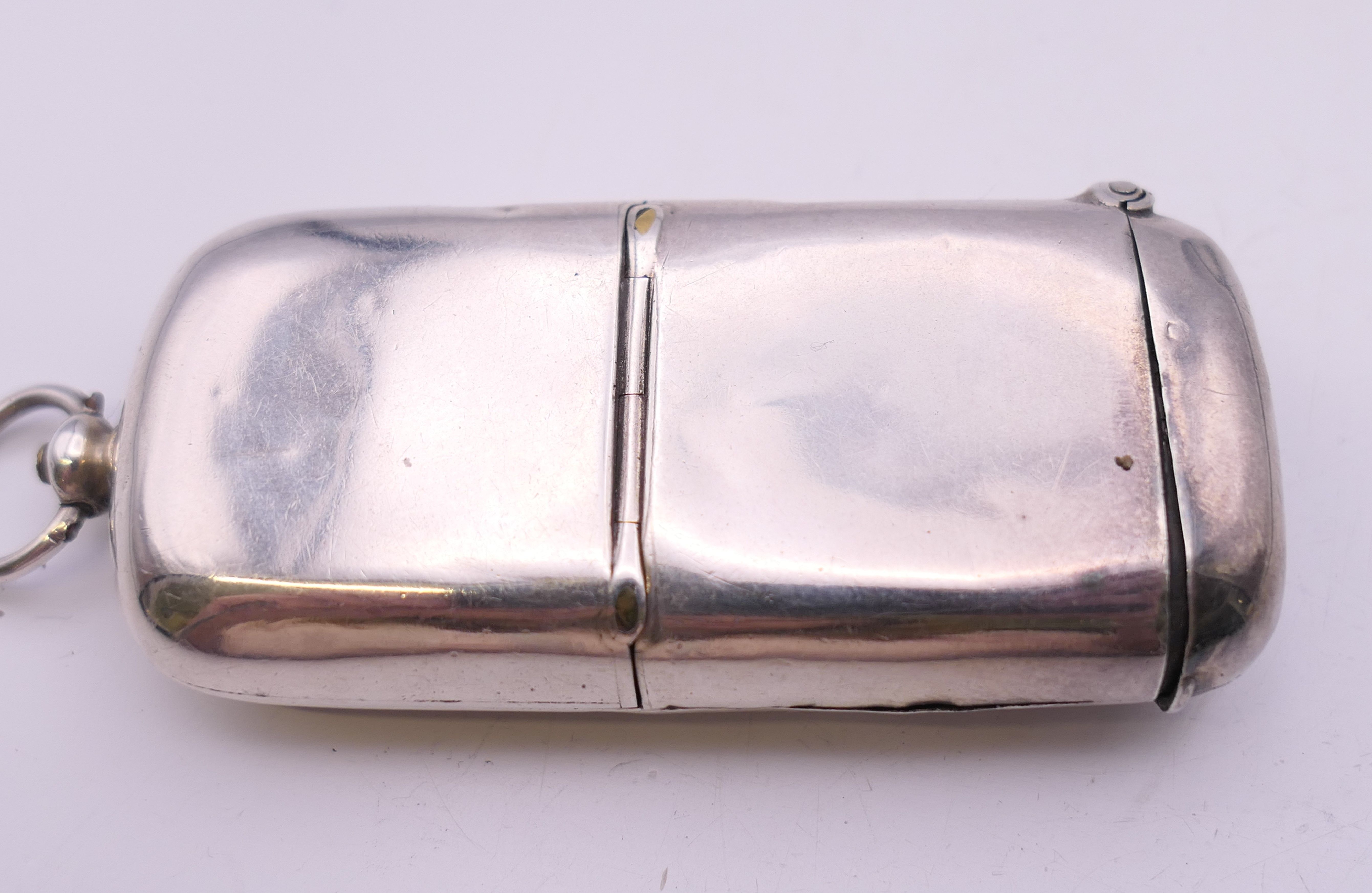 A Victorian silver vesta/single sovereign case, inscribed T H SILK, Chester 1890. 6.5 cm wide. 32. - Image 4 of 10