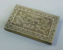 A silver card case. 8 cm long.